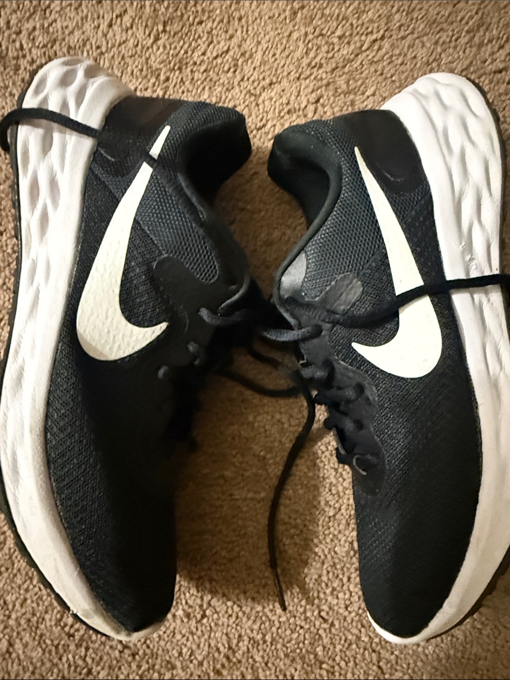 Nike women’s  Black Athletic Sneakers with White Swoosh